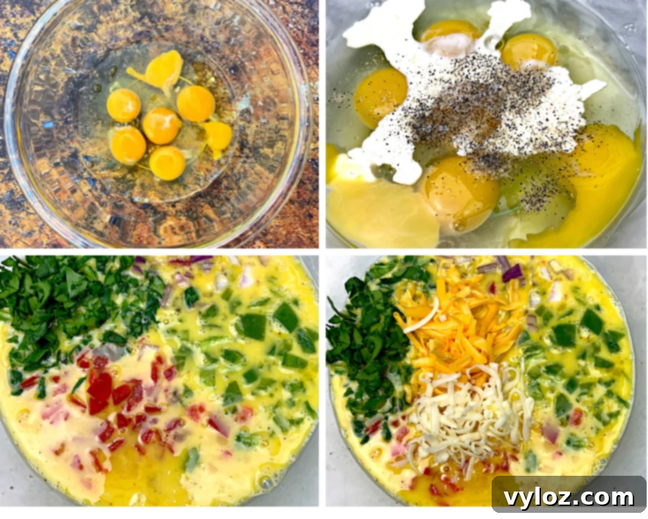 A glass bowl filled with whisked raw eggs and heavy whipping cream, surrounded by bowls of chopped vegetables and shredded cheese, ready for an air fryer recipe.