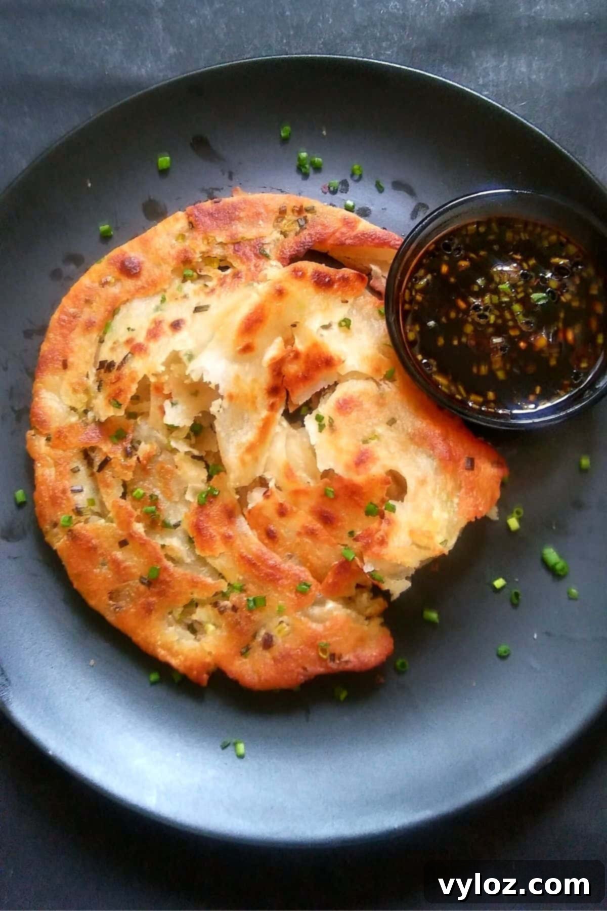 Image showing scallion pancake served with ginger soy dipping sauce.