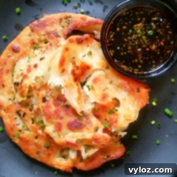 Image showing scallion pancake served with ginger soy dipping sauce.