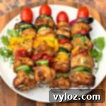 air fryer grilled chicken kebabs on a white plate