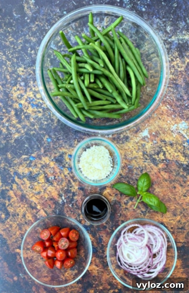 ingredients for cold green bean salad with tomatoes and feta cheese