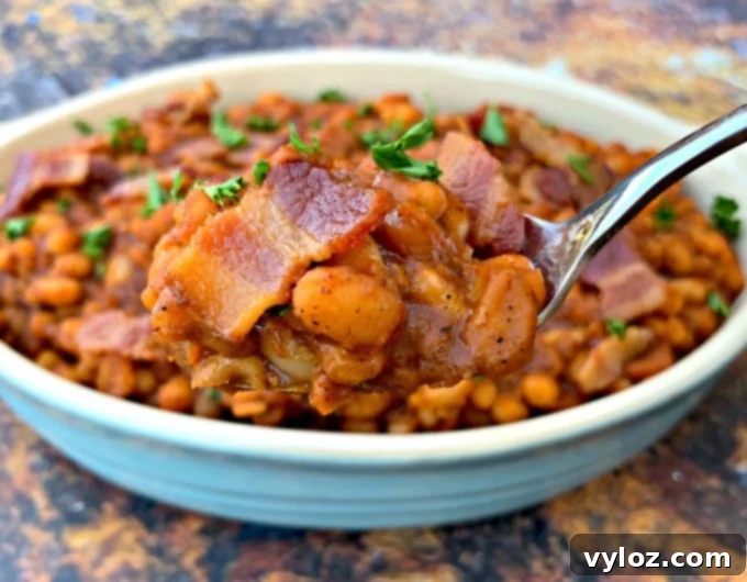 Spoonful of Instant Pot baked beans with bacon