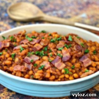 Instant Pot baked beans with bacon in a blue bowl
