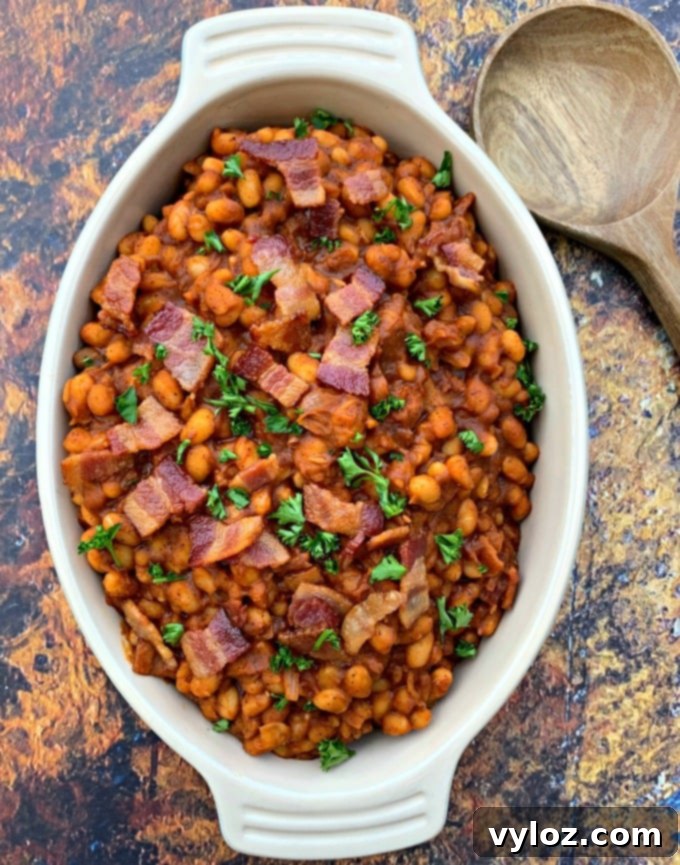 Instant Pot baked beans with bacon in a blue bowl