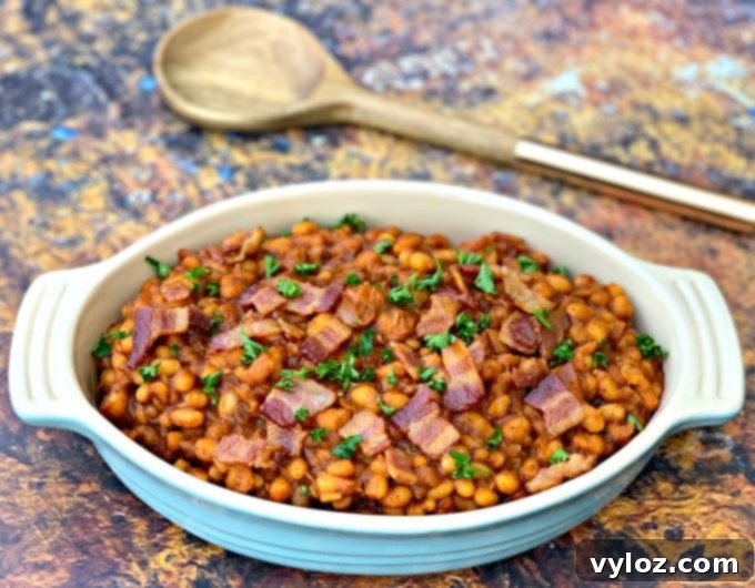 Instant Pot baked beans with bacon in a blue bowl