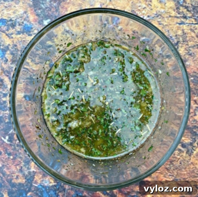 butter, olive oil, parsley and garlic in a bowl for air fryer garlic bread