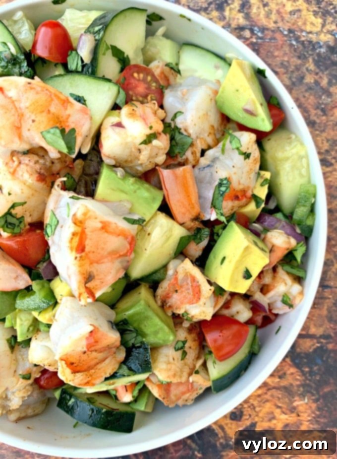 Vibrant Shrimp Avocado Salad 9 keto low carb shrimp avocado ceviche salad in a white bowl