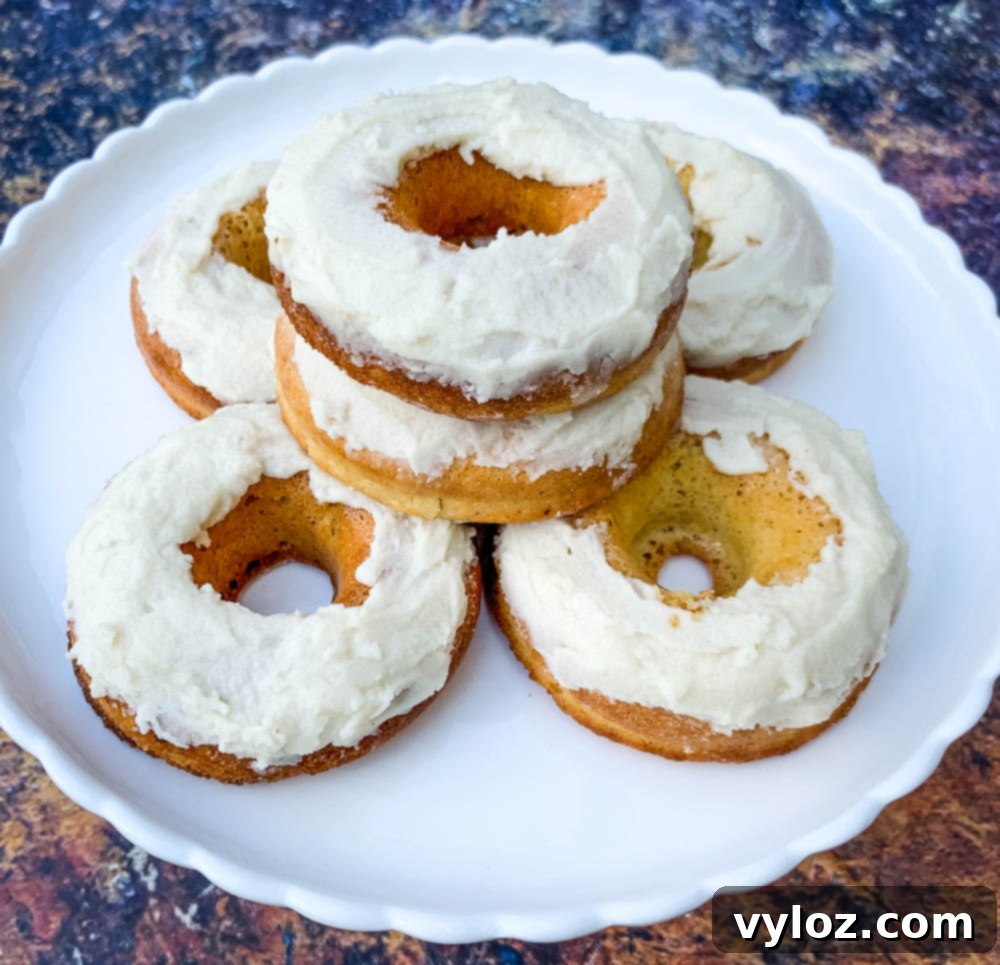 keto low carb donuts with frosted glaze elegantly arranged on a white plate