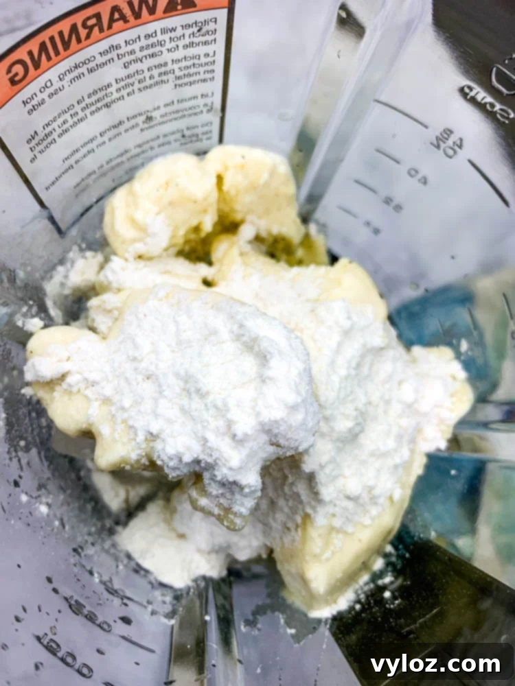 Chick-fil-A frosted lemonade ingredients blending in a high-powered blender, creating a smooth, creamy mixture.