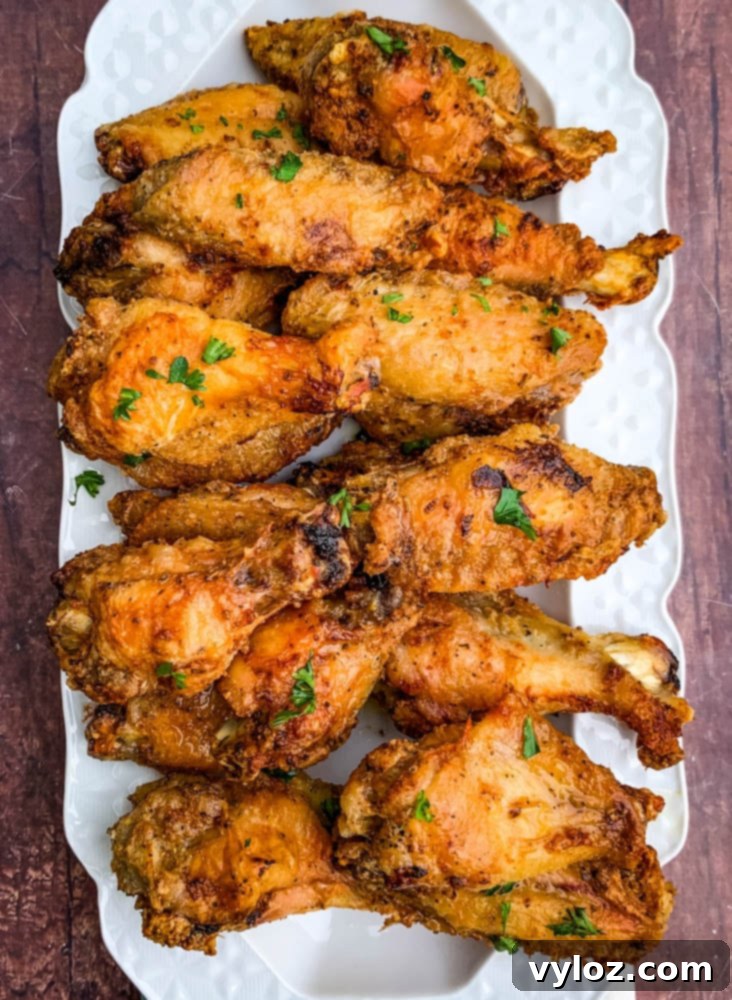Platter of air fryer keto fried chicken wings garnished and ready for serving