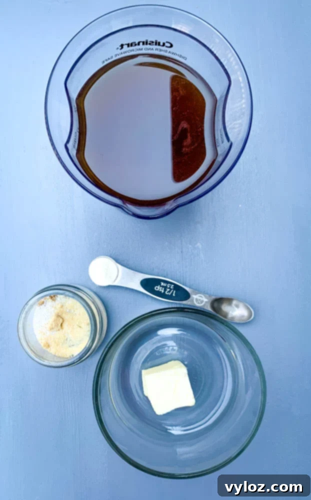 Rich Keto Gravy 3 beef broth, garlic powder, butter, and xanthan gum for keto low carb gravy