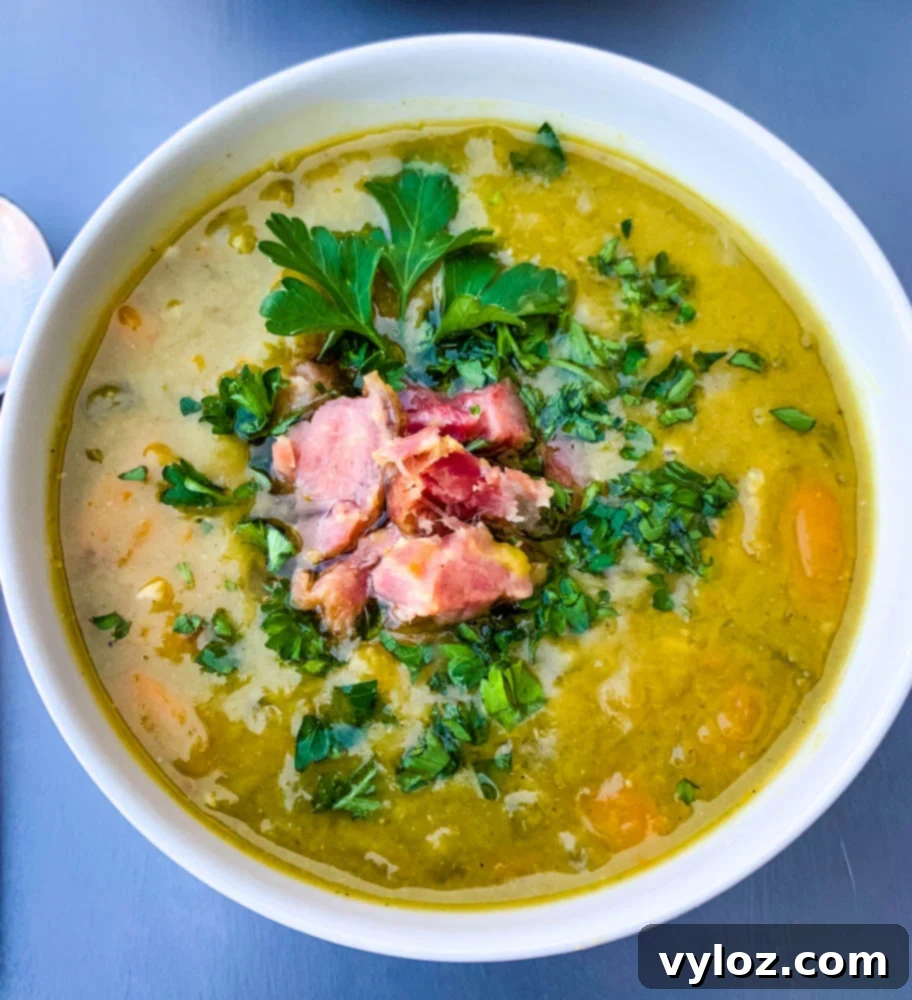 A close-up of hearty Instant Pot Split Pea Soup served in a white bowl, ready to be enjoyed.
