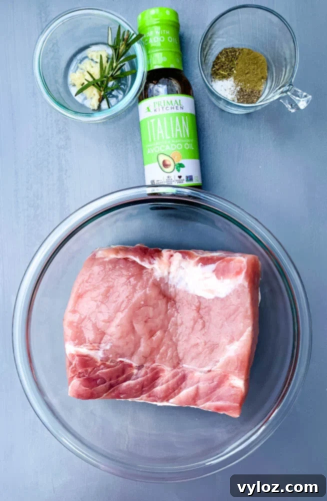 raw pork loin roast, Italian dressing, and seasoning in glass containers