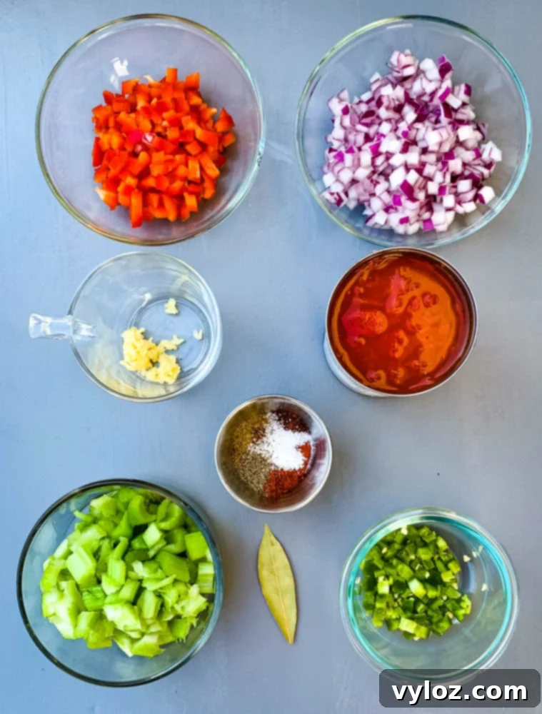 Simple & Savory Instant Pot Black Bean Soup 3 chopped red peppers, chopped onions, garlic, tomatoes, and celery in glass bowls