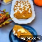 Keto low carb pumpkin bread on a white plate with a slice on a blue plate