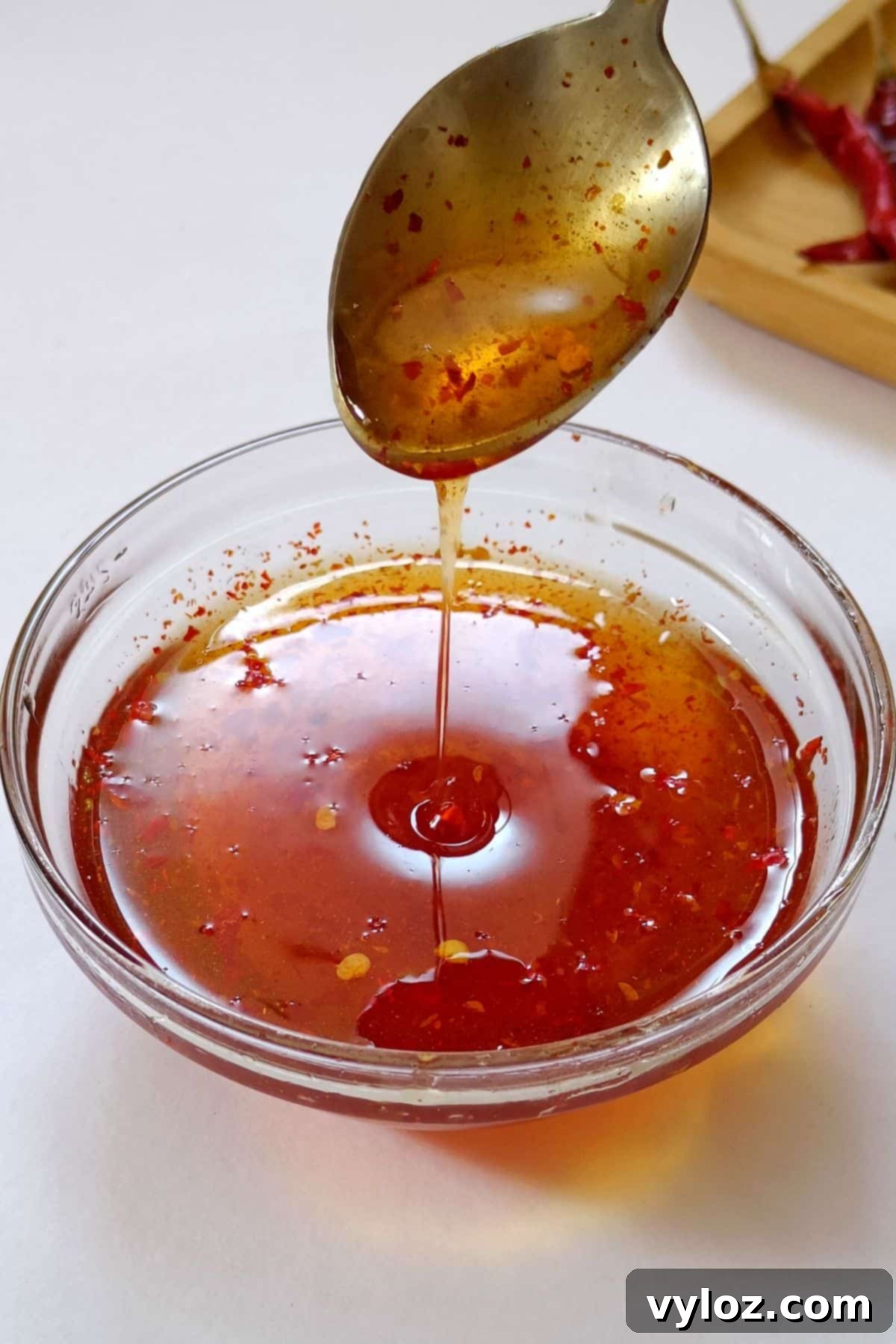 Make Your Own Sweet Heat Honey 2 Image showing hot honey sauce in a glass bowl, ready to be served.