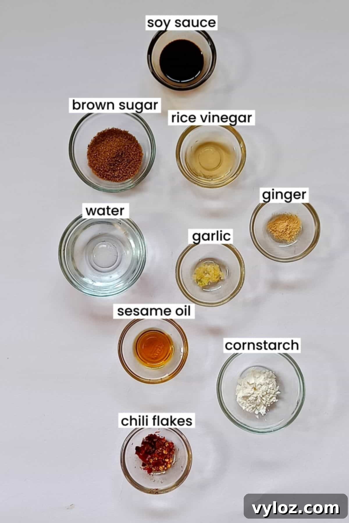 Homemade Asian Zing Wing Sauce 3 A collection of fresh ingredients for Asian Zing Sauce, including soy sauce, rice vinegar, brown sugar, garlic, and ginger.