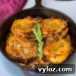 Smothered Keto Pork Chops 9 Keto low carb smothered pork chops in a cast iron skillet