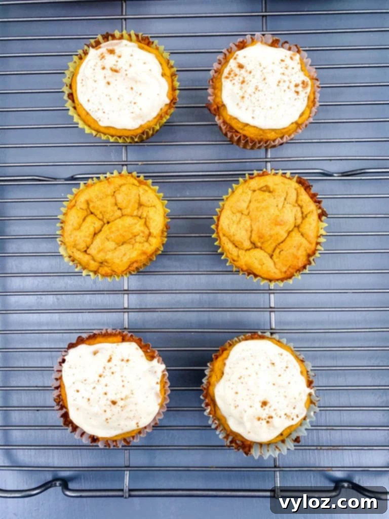 keto pumpkin muffins with cream cheese on a cooling rack