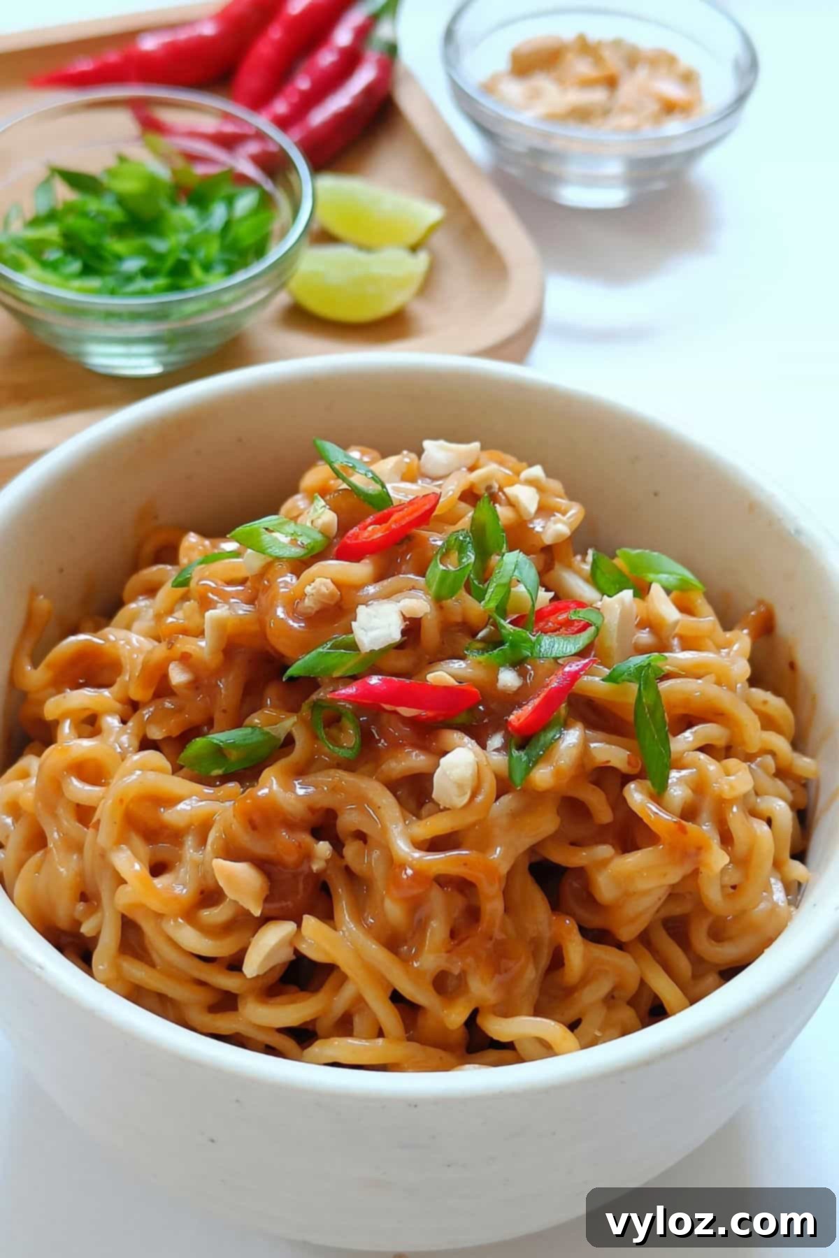 Image showing creamy peanut butter ramen served in a white bowl.