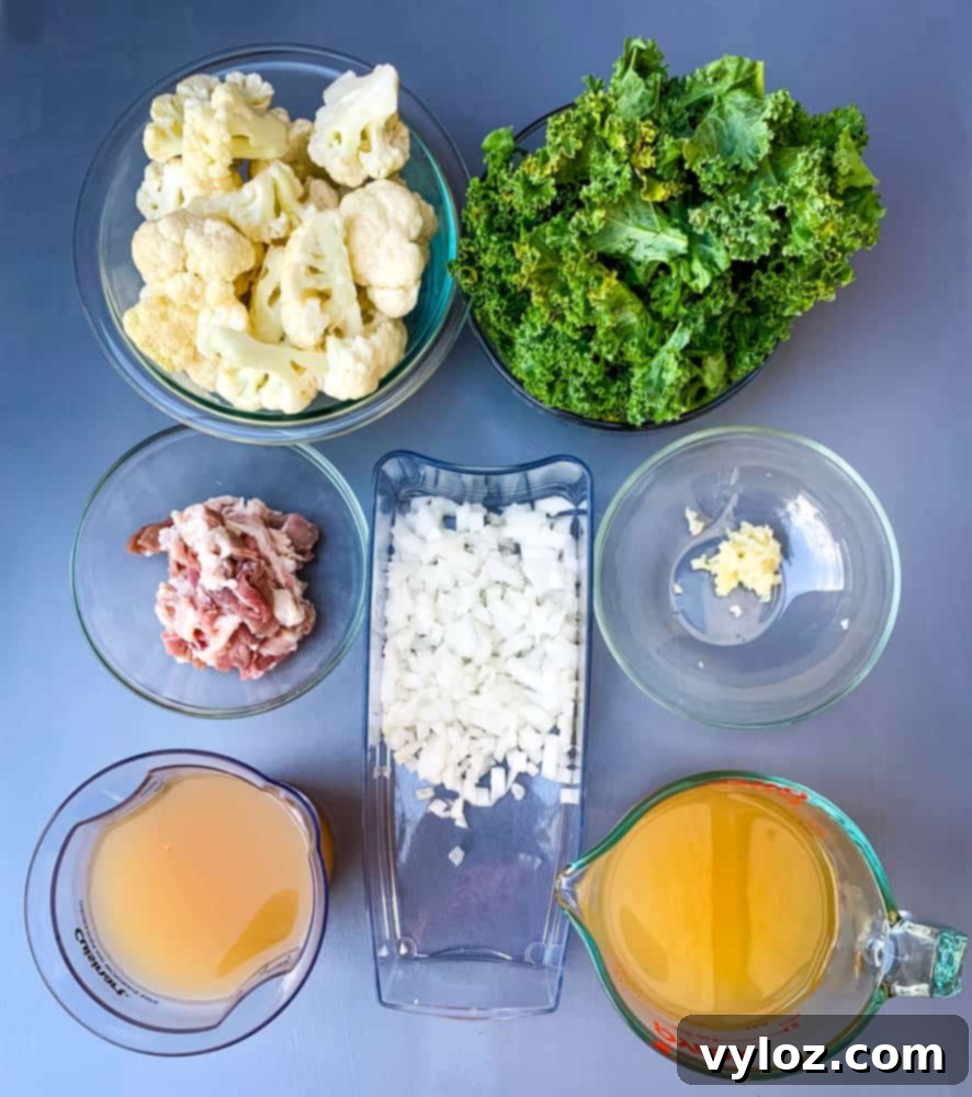 fresh cauliflower, fresh kale, uncooked bacon, chopped onions, garlic, and chicken broth