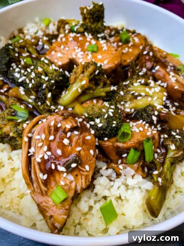 Instant Pot teriyaki chicken in a white bowl, closeup shot