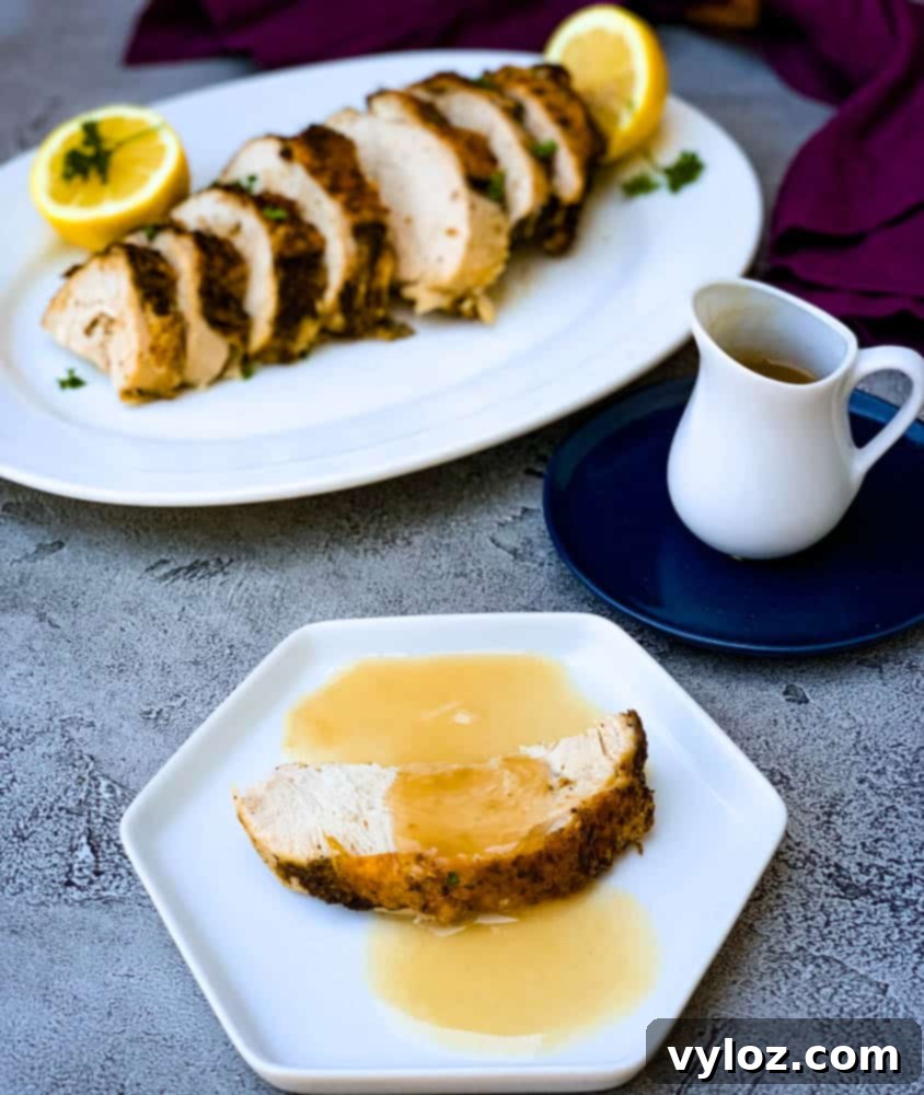 air fryer roasted turkey breast with gravy on a white plate