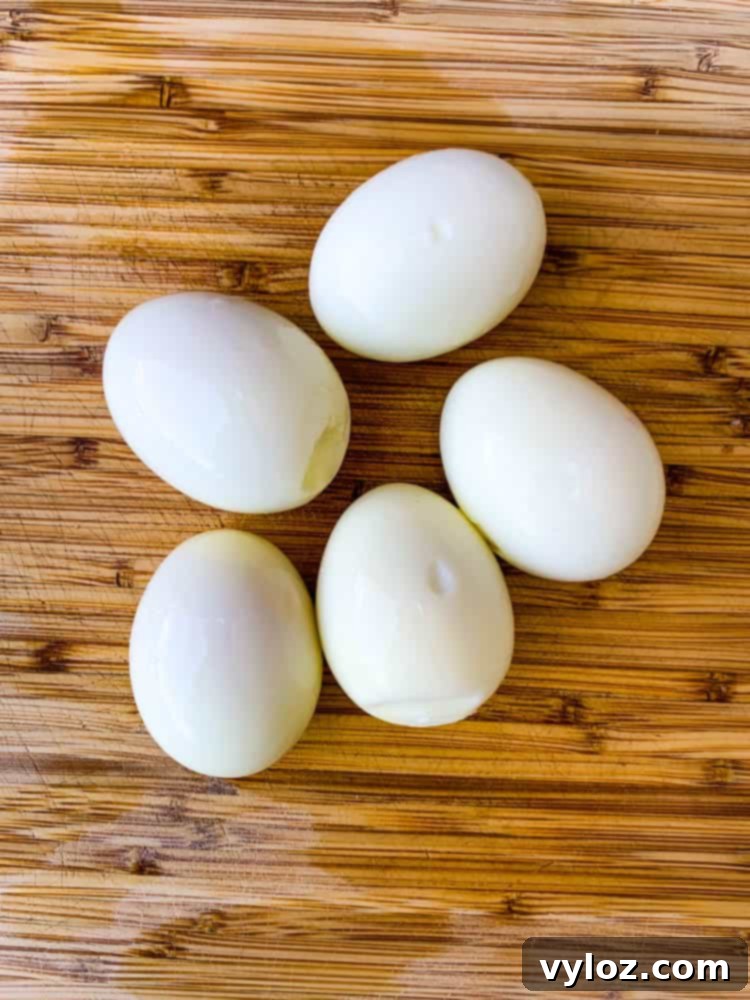 air fryer hard boiled eggs on a bamboo cutting board