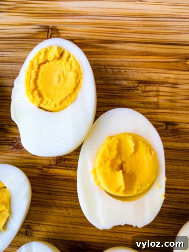 air fryer hard boiled eggs on a bamboo cutting board