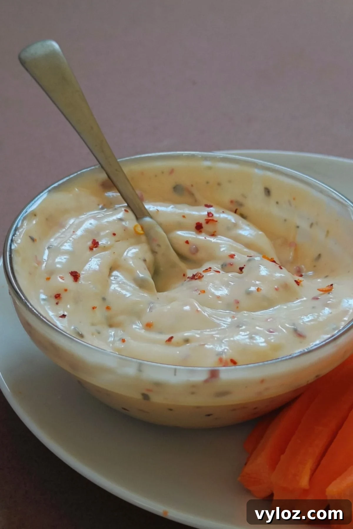 Copycat Buffalo Wild Wings Garlic Parmesan Sauce Recipe 2 Image showing creamy garlic parmesan sauce in a bowl.