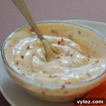 Copycat Buffalo Wild Wings Garlic Parmesan Sauce Recipe 6 Creamy buffalo wild wings garlic parmesan sauce in a glass bowl.