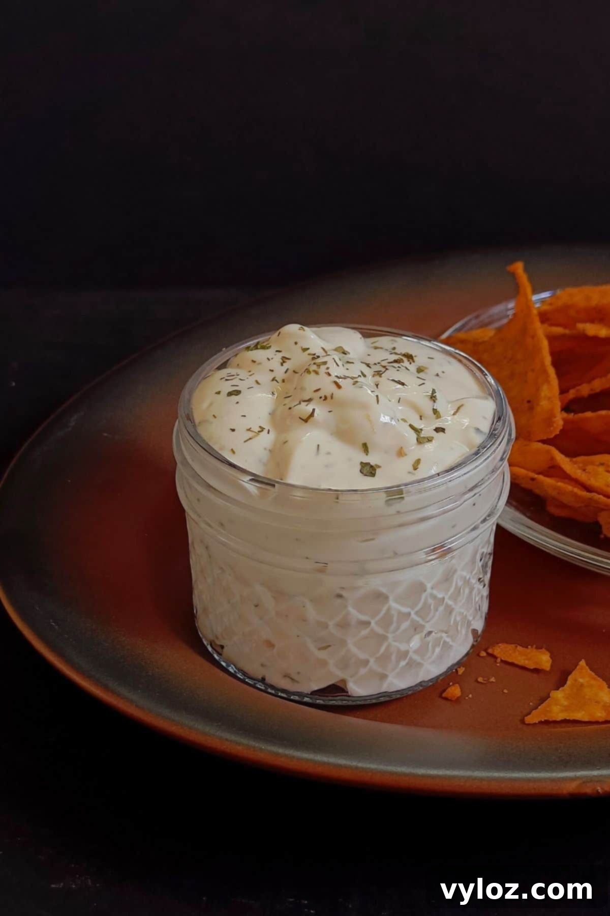 The Ultimate Homemade Wingstop Ranch 5 Creamy Wingstop ranch dressing showcased in an elegant glass jar, ready for serving.