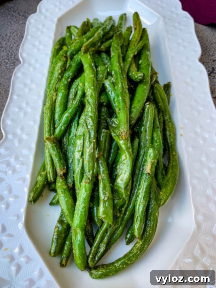Crispy Air Fryer Garlic Green Beans 9 air fryer garlic green beans on a white plate