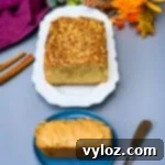 keto low carb zucchini bread on a white plate and a slice of zucchini bread on a blue plate with almond butter