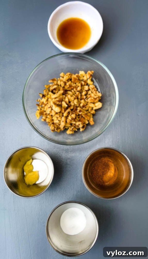 Nuts, ginger, and spices in separate bowls, ready for keto zucchini bread