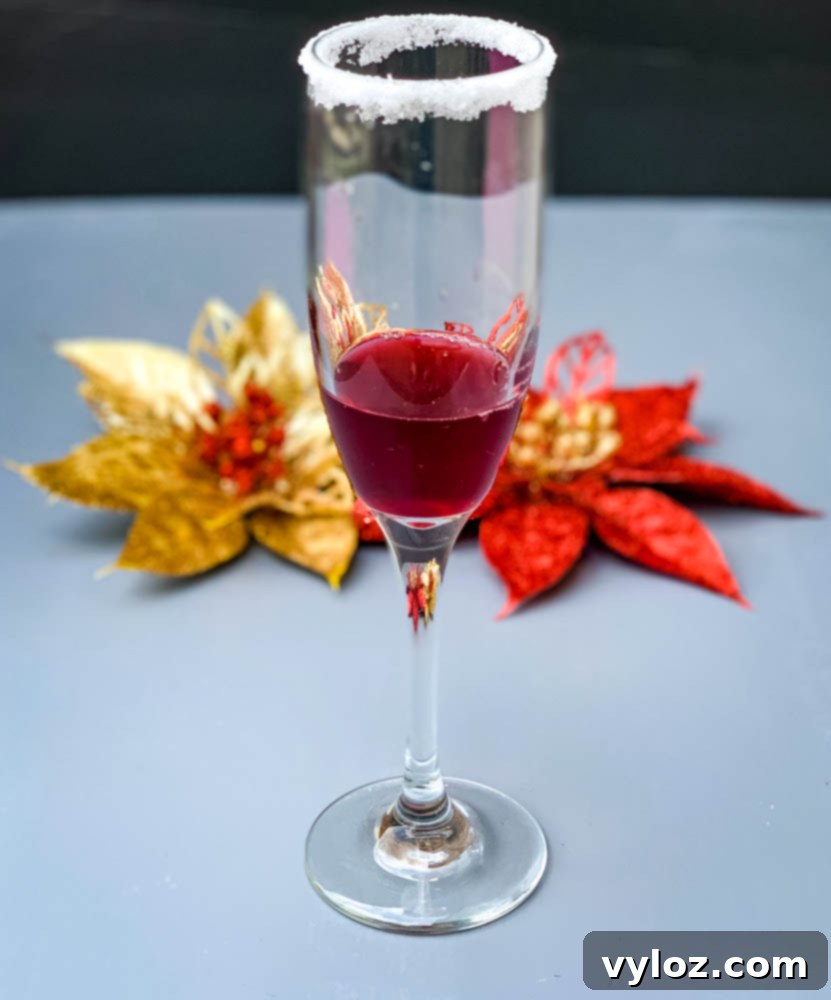Crimson Mimosa 6 Cranberry juice poured into a champagne flute, ready for sparkling wine