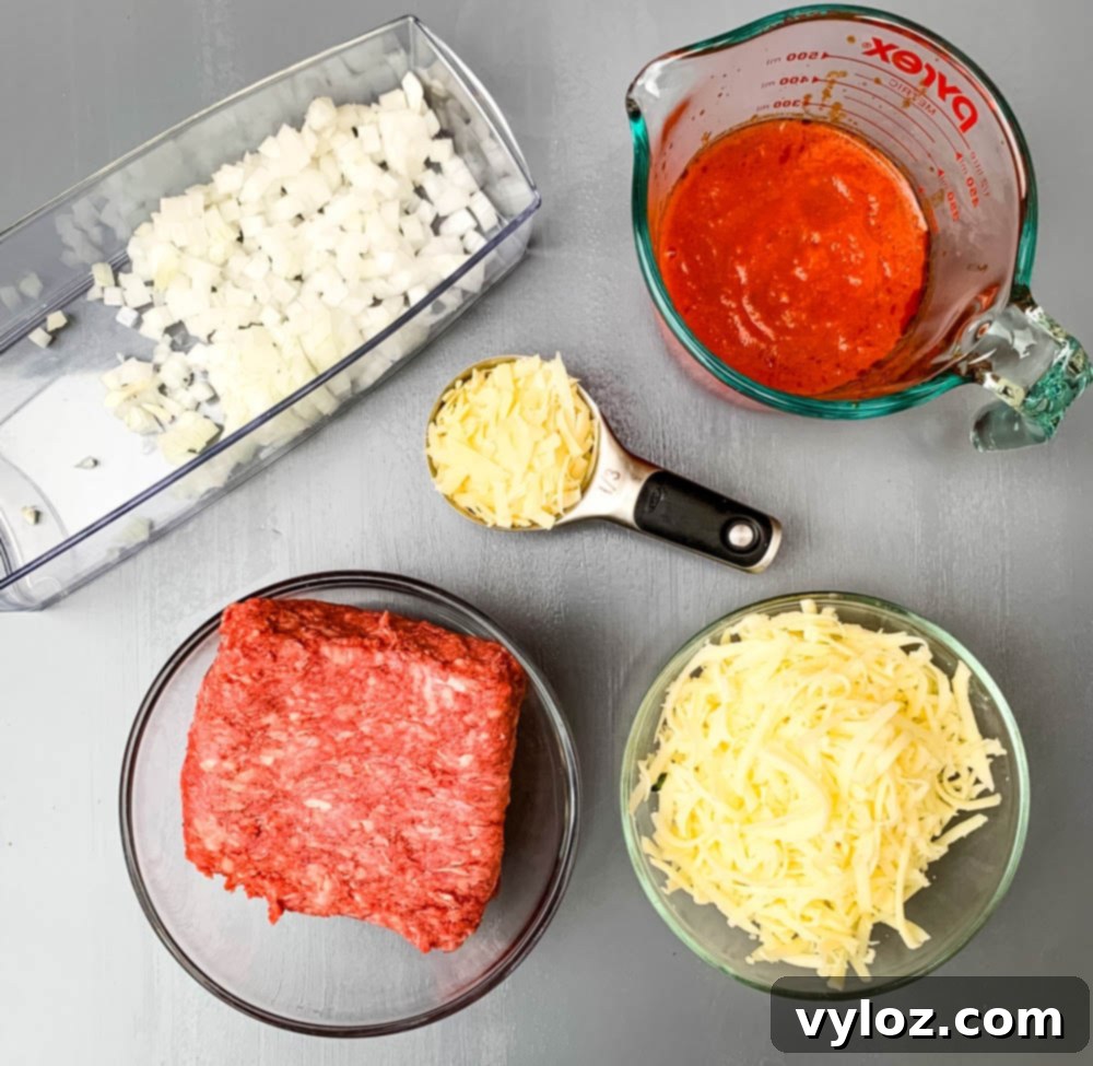 Quick Zucchini Lasagna Pinwheels 3 Glass bowls containing chopped onions, raw ground beef, marinara sauce, and shredded cheese, ingredients for zucchini lasagna roll ups.