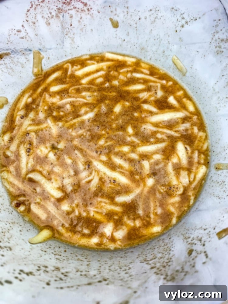 A perfectly cooked cinnamon roll chaffle, golden brown and ready to be served.