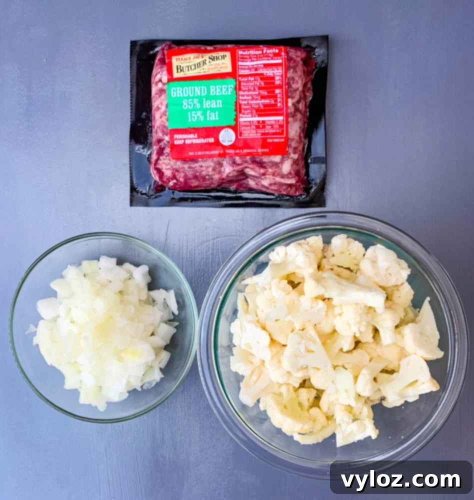 Savory Keto Cheeseburger Bliss 3 Raw ingredients for keto cheeseburger soup: fresh ground beef, florets of cauliflower, and finely chopped onions.