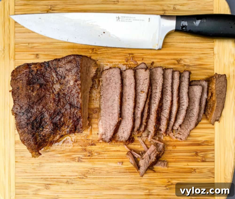 Tender Instant Pot Brisket 7 Instant Pot Brisket sliced on a cutting board