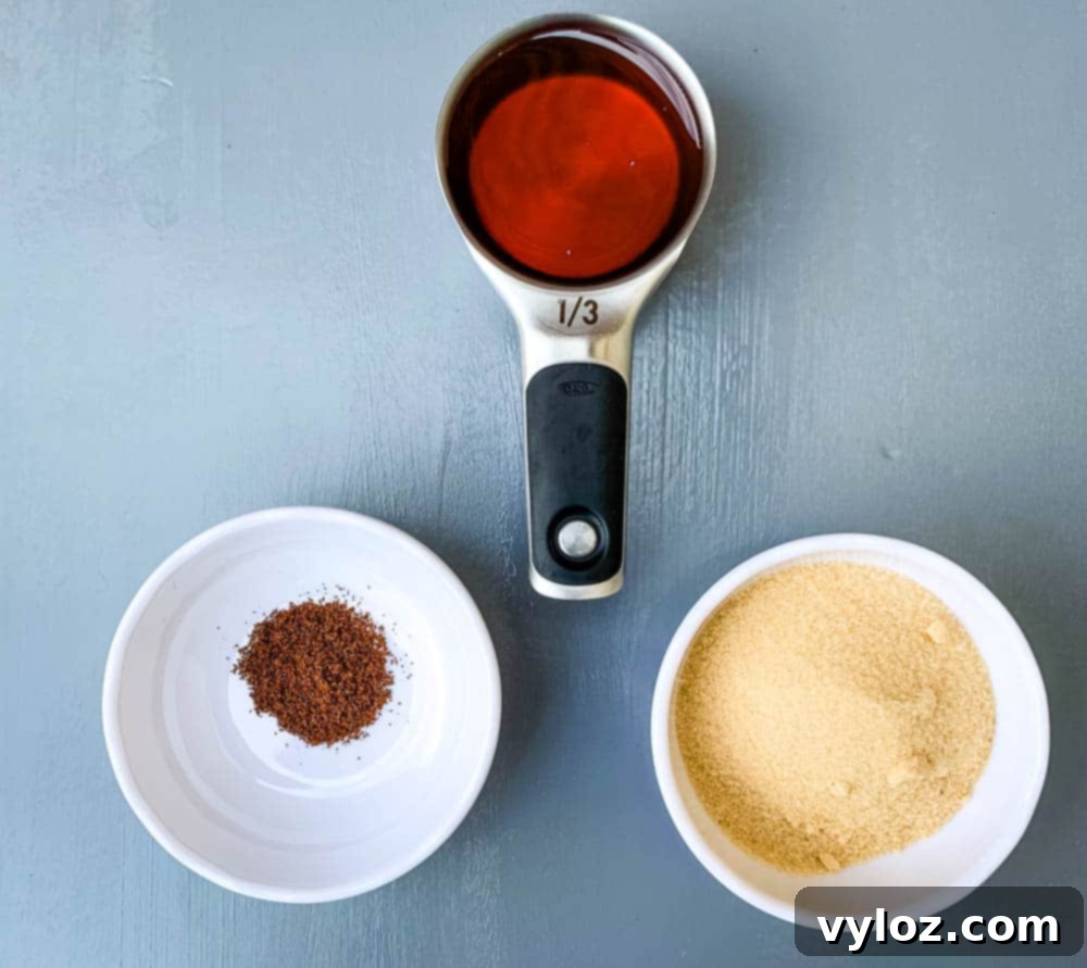 A charming display of honey, ground cloves, and brown sugar—key ingredients for creating a delicious air fryer honey glazed ham—arranged on a rustic wooden surface.