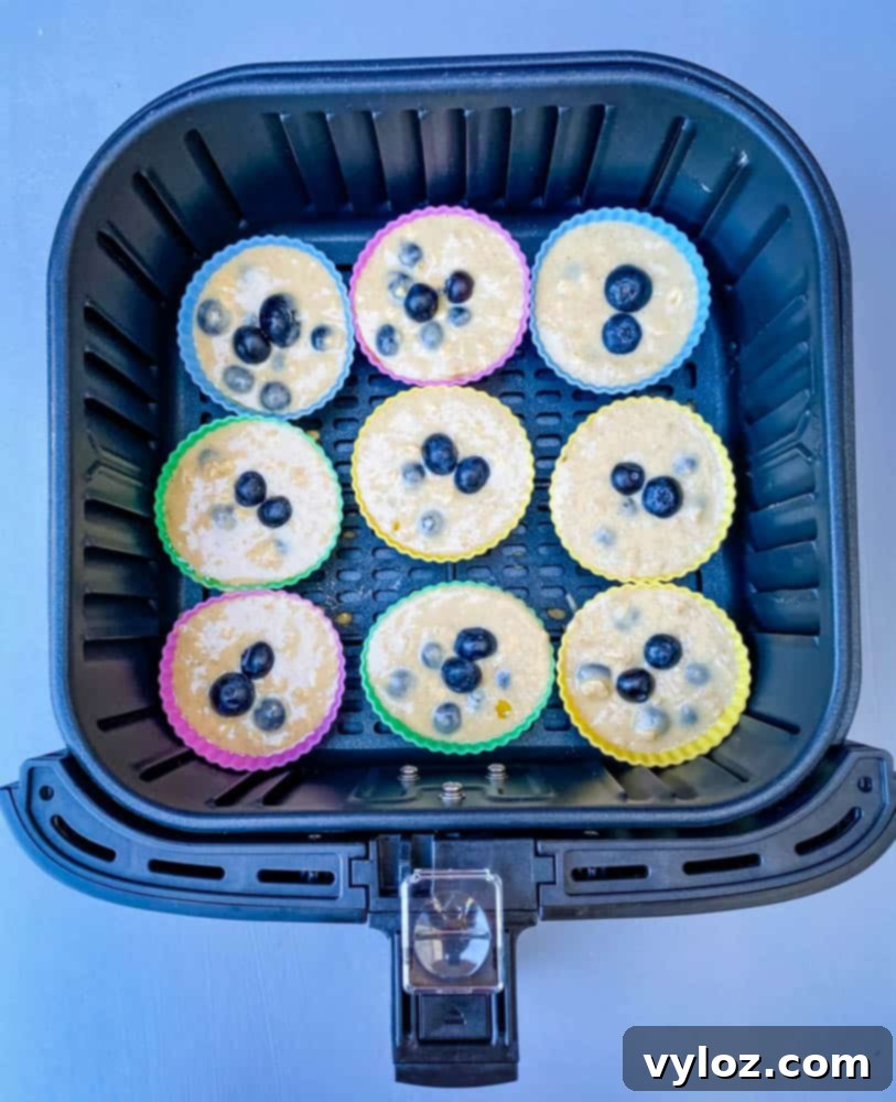 uncooked blueberry muffins in an air fryer