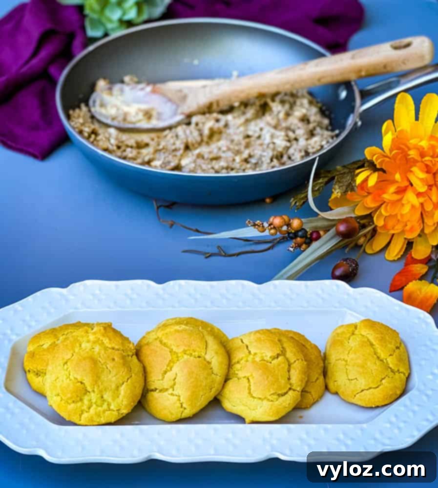 Delicious keto low carb biscuits and gravy served on a white plate, ready to be enjoyed as a hearty breakfast or brunch.