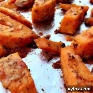 Parmesan Sweet Potatoes on a foil lined baking sheet