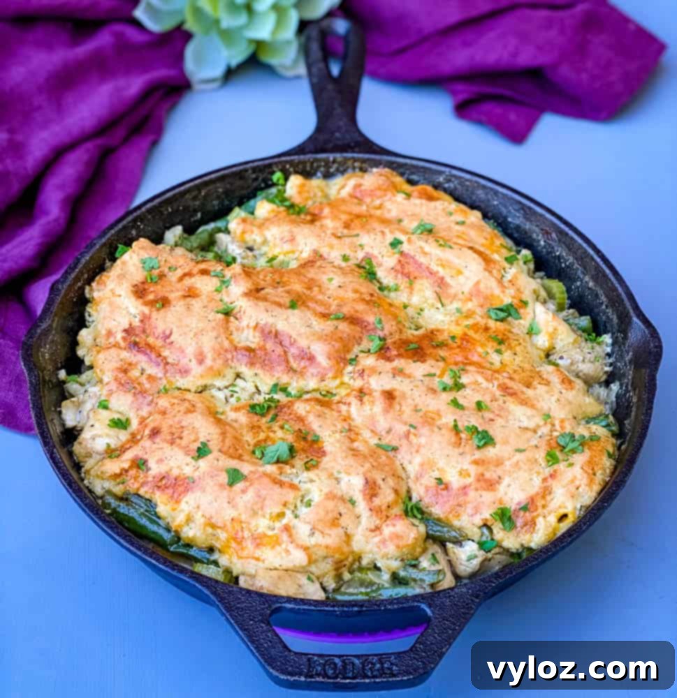 Keto Low-Carb Chicken Pot Pie in a cast iron skillet, golden brown crust on a creamy vegetable and chicken filling