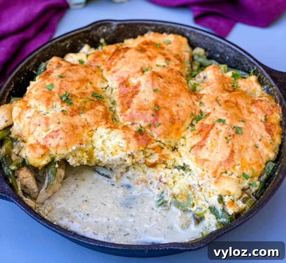 A beautifully baked keto low carb chicken pot pie, golden and bubbly in a cast iron skillet