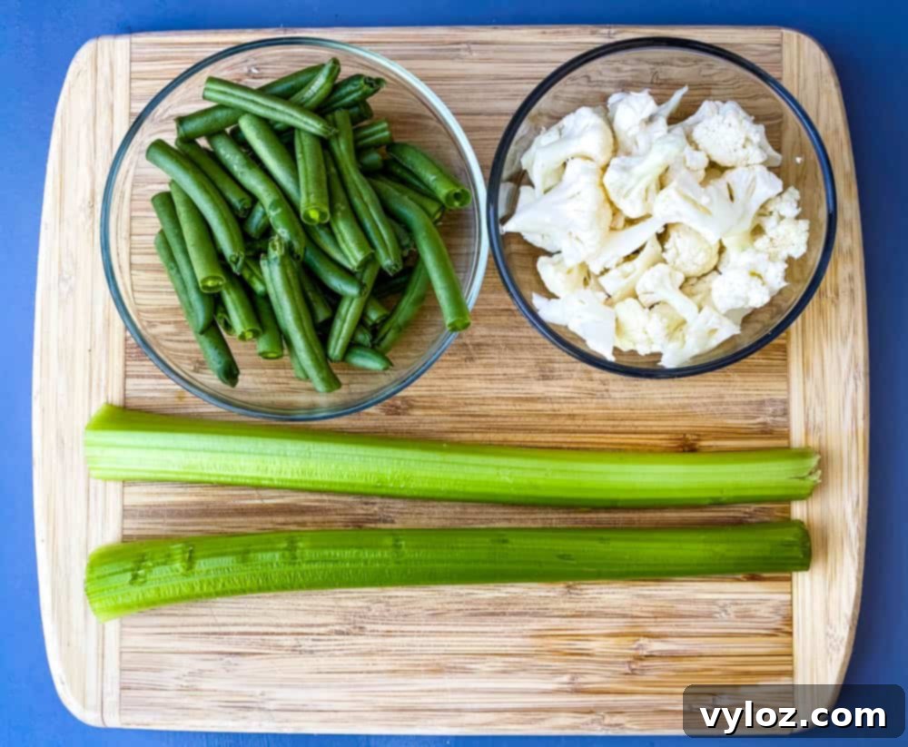 Sliced green beans, celery, and cauliflower for keto low carb chicken pot pie recipe