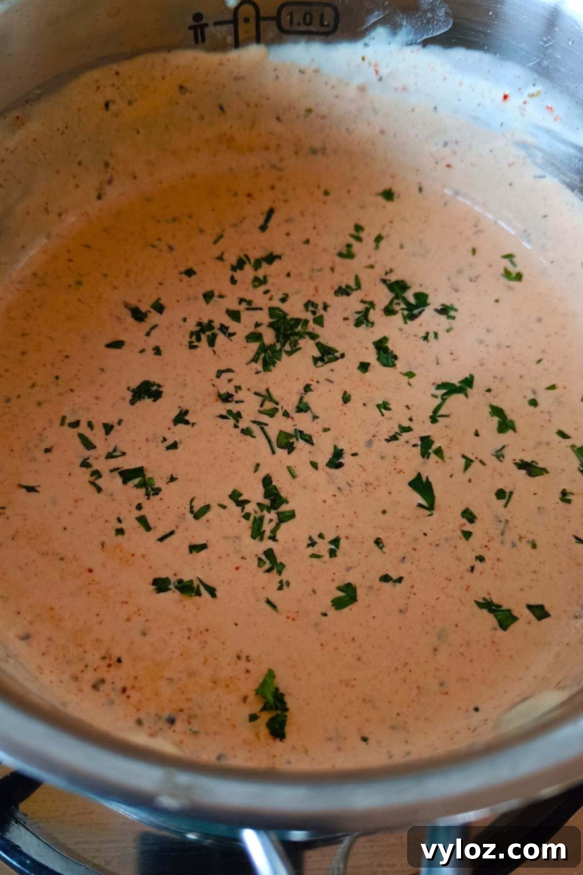 Image showing creamy Cajun Alfredo sauce in a saucepan.