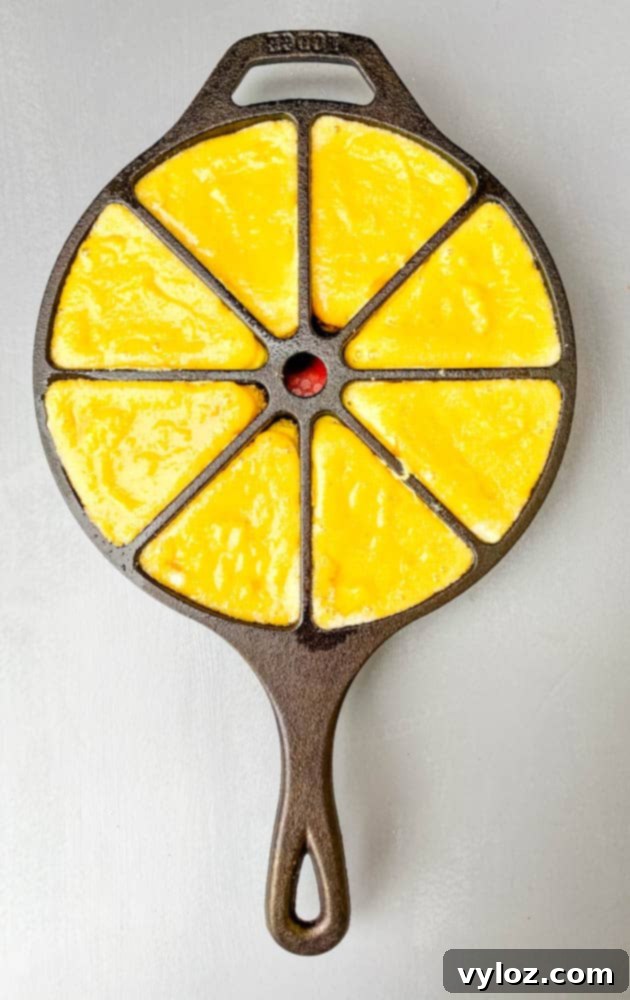 keto low carb cornbread in a cast iron wedge pan skillet