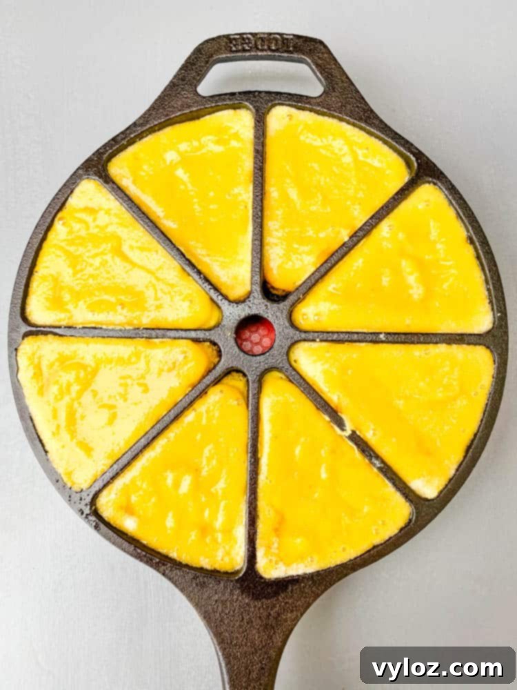 keto low carb cornbread in a cast iron wedge pan skillet